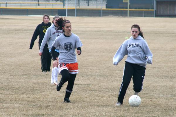 Sophomore Ann Marie Giese and freshman Delaney Stryczek scrimmage at girls soccer practice.