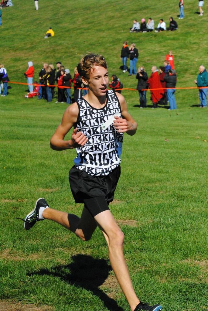 Kyle Carter runs in the conference meet at the Geneseo course
