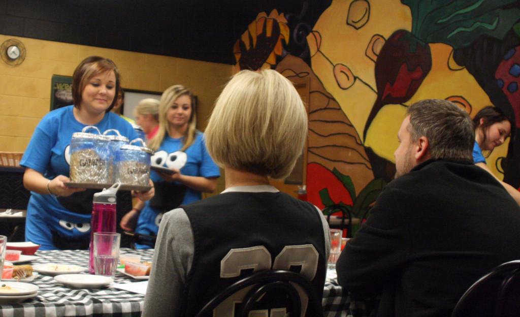 Contestants present the monster cookie to judges Michelle Jurcenko and Patrick Trapp. Photo by Tyler Keenum.