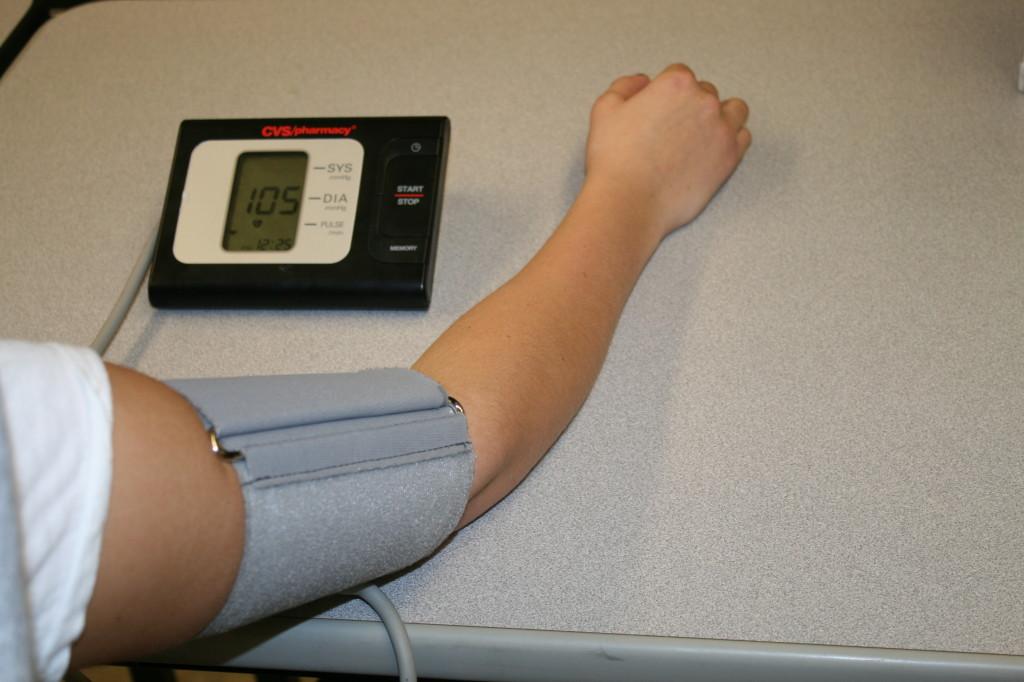 A Kaneland student checks their blood pressure.