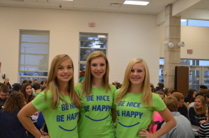 Tiffany Tompson, Kendal Anderson, and Kiley Roach showing pride in wearing the color green 