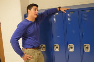 Junior Dom Cozzi shows off his sweater and khaki's against his locker