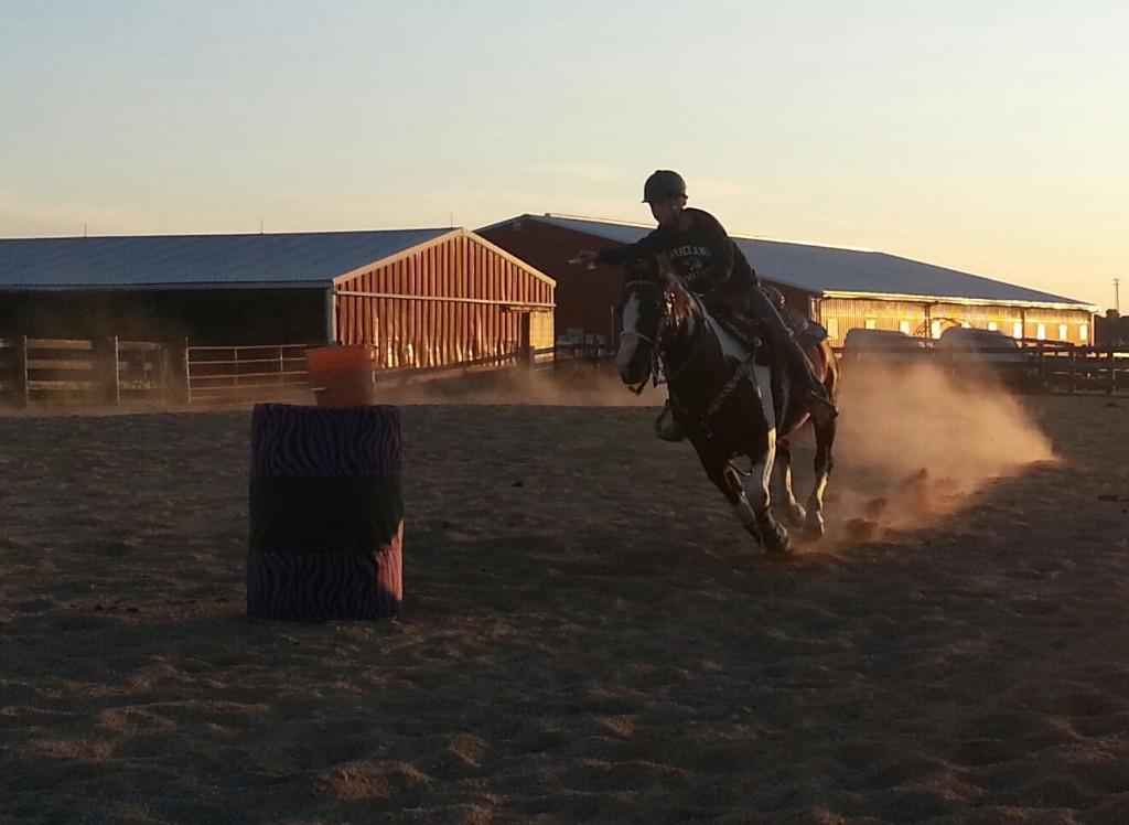 Taylor Emigh, practicing barel racing on her horse, Ranger. 