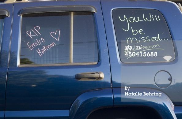A students car bears a message that expresses grief over the Reynolds school shooting that took the life of freshman Emilio Hoffman.