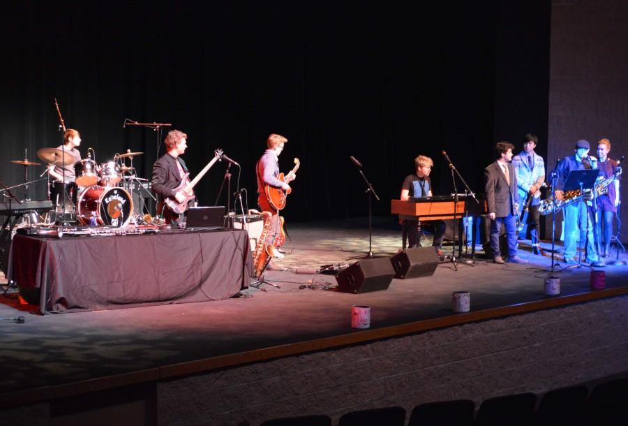 Students+and+staff+participated+in+the+Battle+of+the+Bands+and+performed+several+sets+in+the+auditorium.+