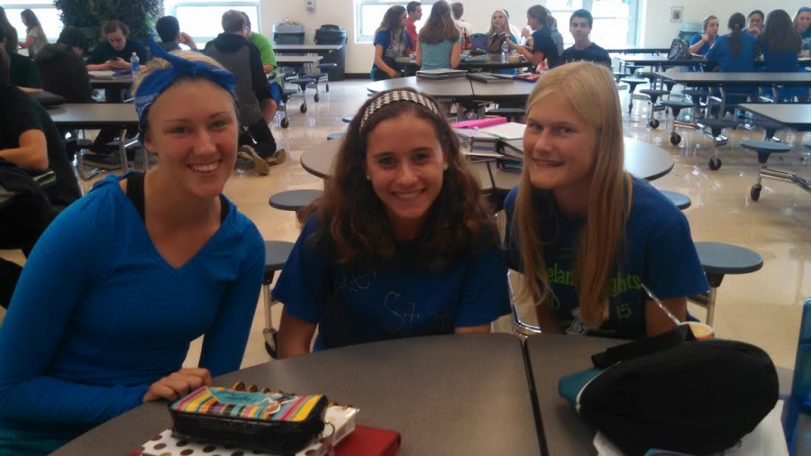 Seniors Sam Sommerville, Carly Bartholomew and Bri Bower work the blue on class color day. 