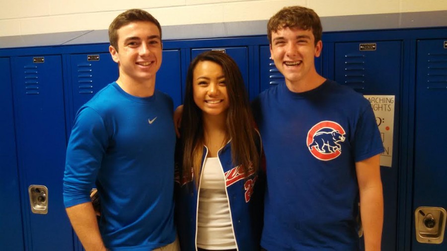 Seniors Tyler Paulson, Kim Vencer, and Justin Peterson go big and blue for class color day. 