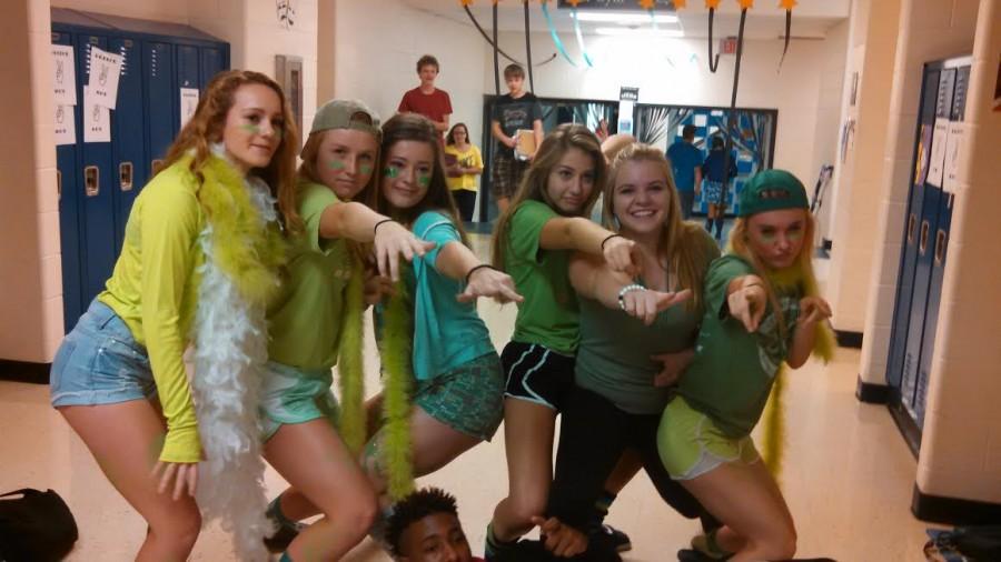 Sophomores Megan Weber, Mallory Burgin, Katie Moore, Macey Knightly, Morgan Angelo and Emily Descoteaux strike a pose in their green apparel. 