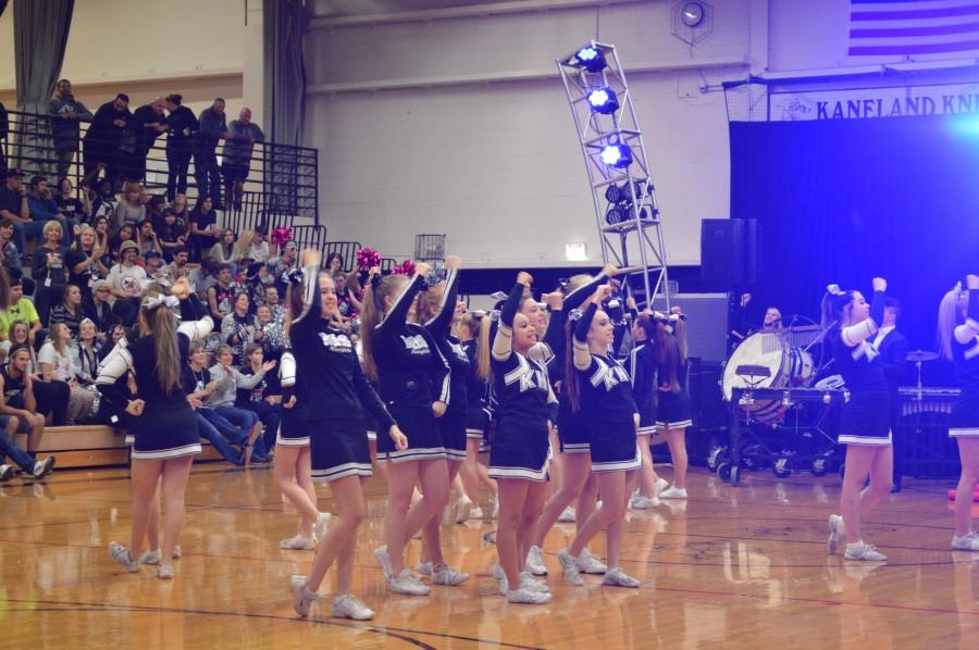 The cheerleaders lead the students in the victory chant. 