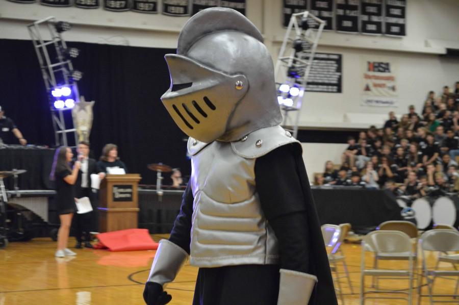 Knights mascot struts around the gym. 