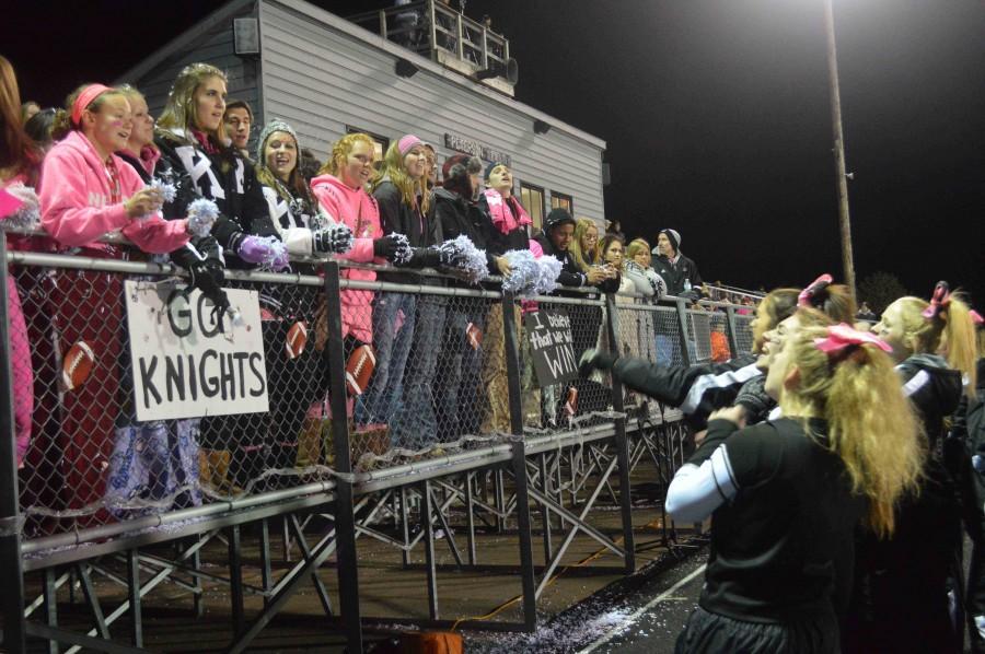 Student section interacts with the cheer team. 