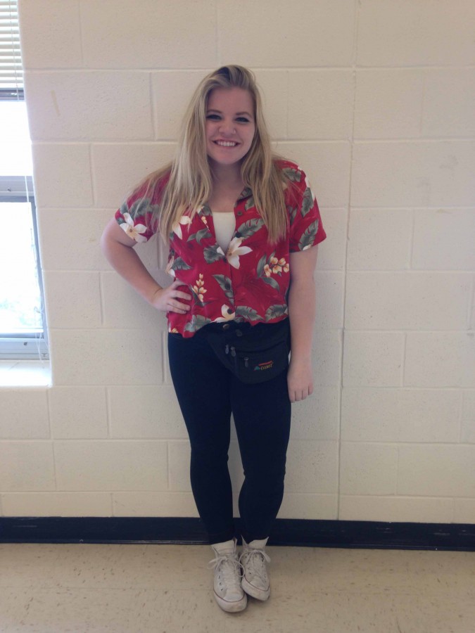 Sophomore Morgan Angelo pairs a red Hawaiian shirt with a classic fanny pack for Holiday Vacation Day.

