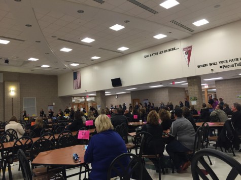 District 302 teachers come together as one to discuss their contracts.