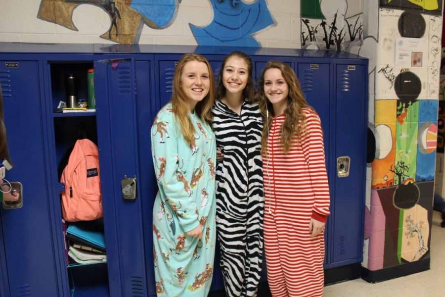Sophomores Mallory Burgin, Macy Knightly and Megan Weber rock the footie pajamas throughout the school day. 