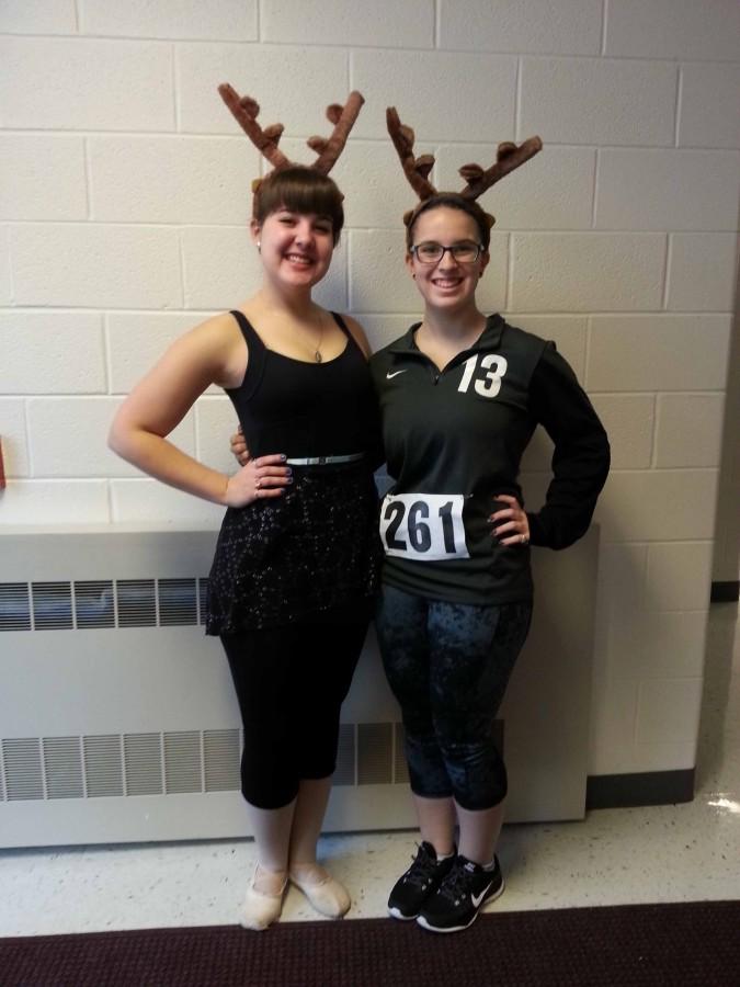 Seniors Aimee Frost and Julia Lemp get in the holiday spirit and dress as reindeer for movie character day.
