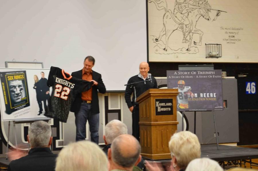 Beebe+is+blindsided+as+Thorgeson+presents+him+with+a+replica+of+his+1983+jersey%2C+announcing+the+school+is+retiring+his+number.