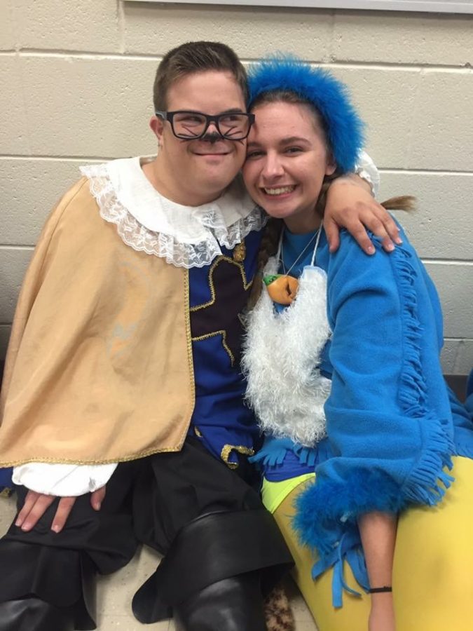 With happy smiles on their faces Michael Castrisis  and Cassidy Garland are showing off their Shrek fashion as puss in boots and a blue bird.