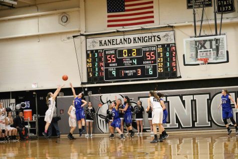 Junior Jenni Weber shoots at the buzzer. With 0.2 seconds left on the clock at the end of the 4th quarter she tried to force the game out of overtime.