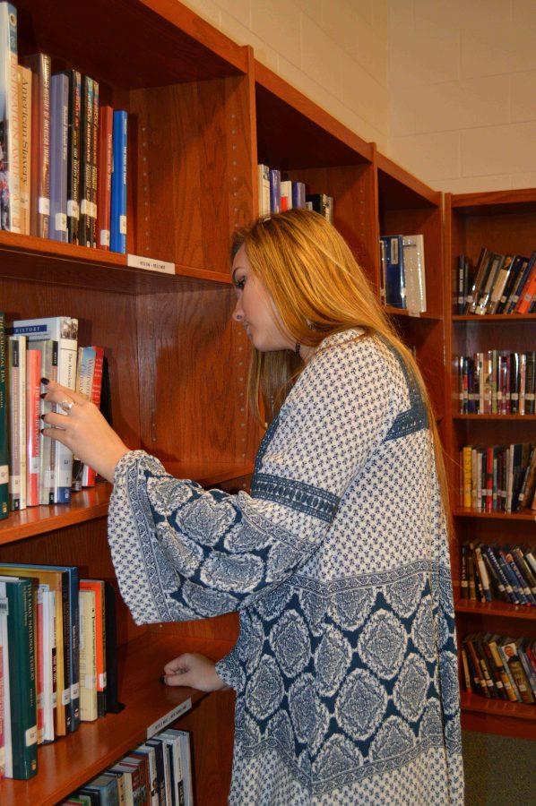 Senior Kylie Modaff is looking for the perfect book to read. Soon the library will have more books for students.