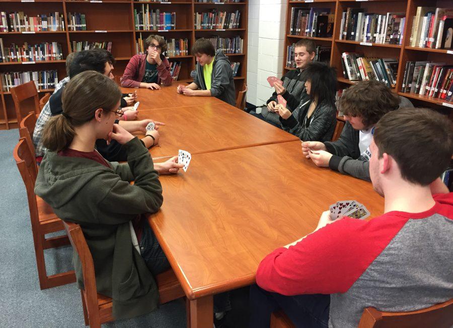 A part of the Sci-Fi Anime club enjoy a quick game of cards in their annual meet up on Thursday. The three visibly seen in the back corner are Isaac Martin, James Leyden and Josh Childress helped set the game up and come to about every meeting. 
