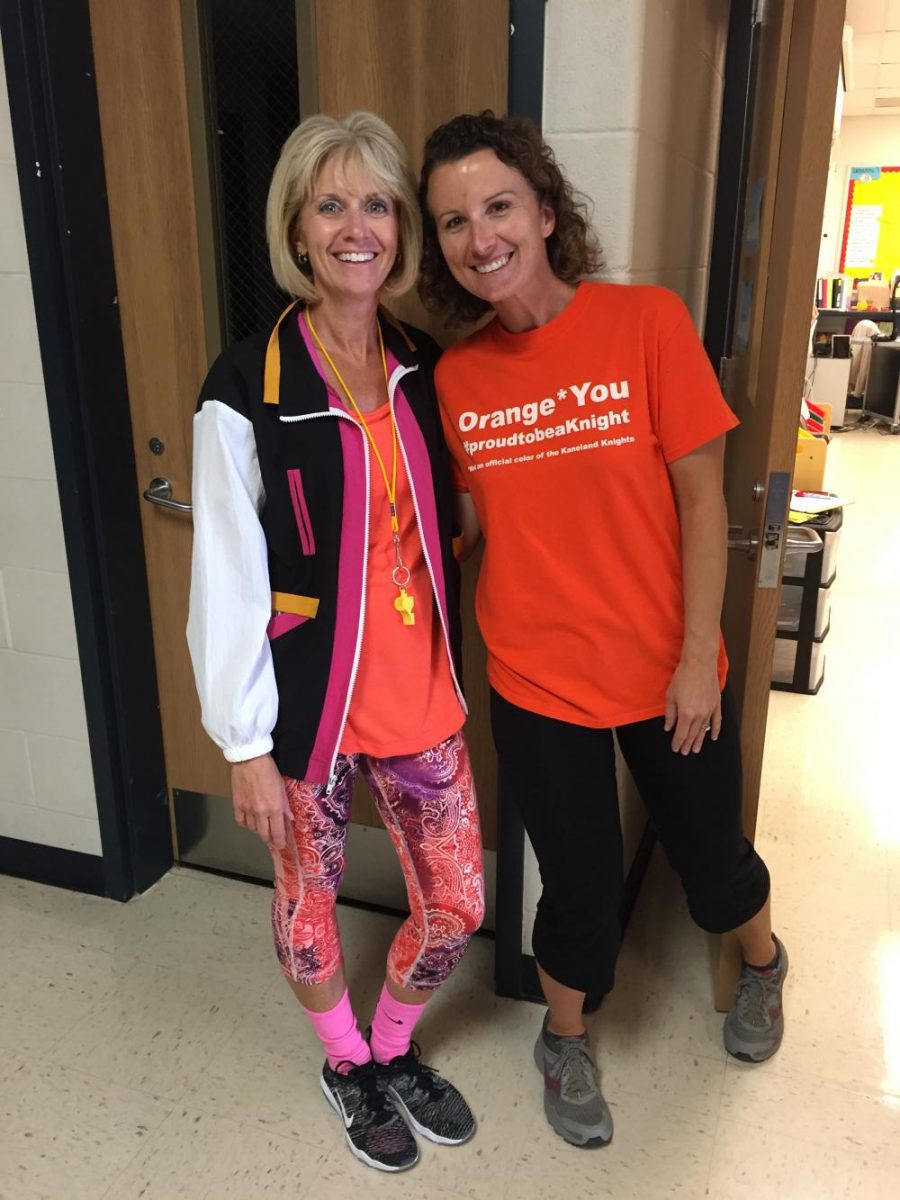 Spanish teachers Michelle Jurcenko and Faye Licari smile in their work out clothes.