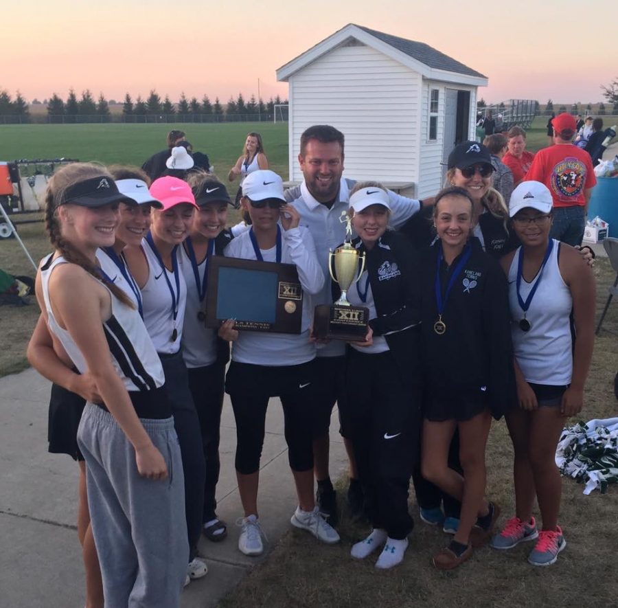 The varsity tennis team holds up their trophy after winning conference.




Photo courtesy: Mallory Stoffregen