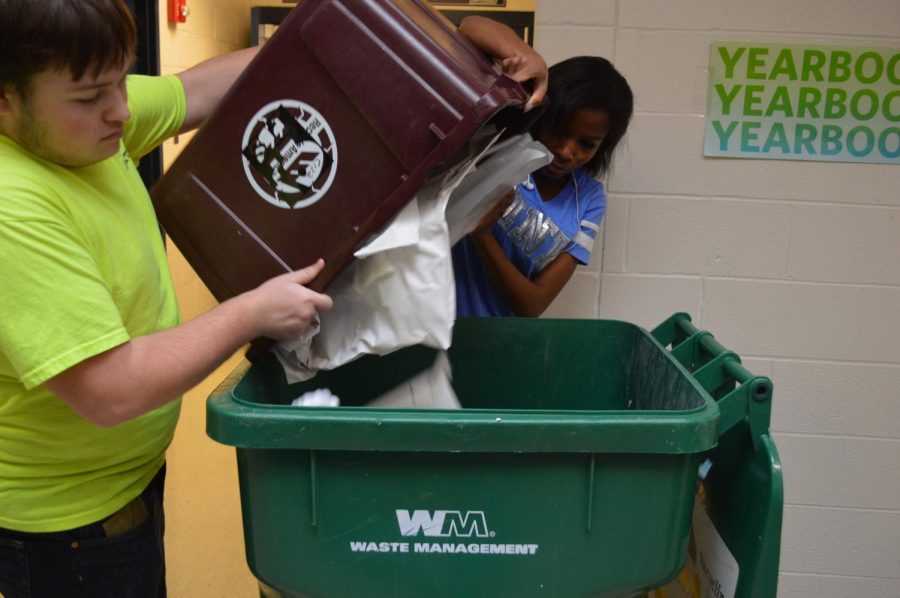 Sophomore Noah Treadway and Junior Nyalah Thomas help each other recycle.  These Brighter Future Club students help recycle every Thursday.