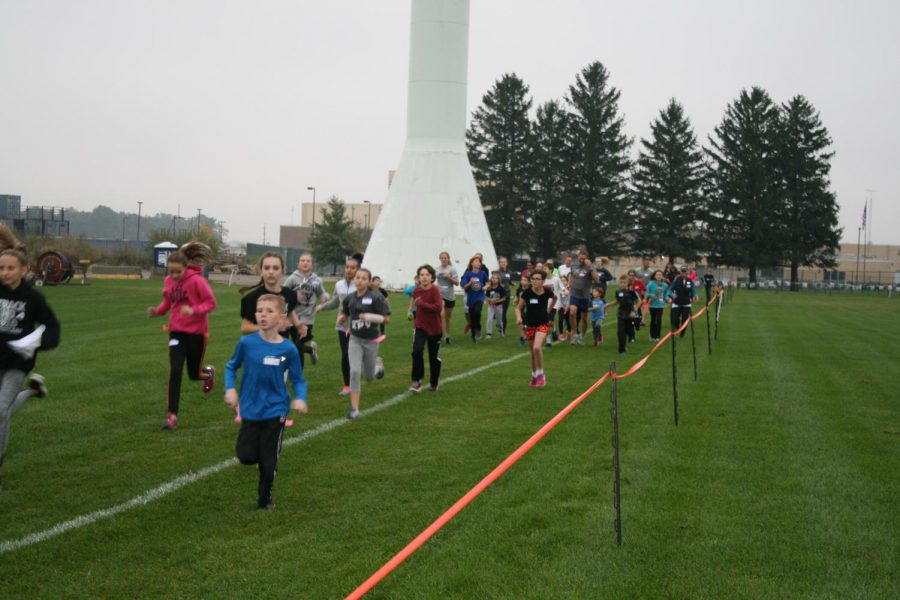 The Run for Your Life race begins. The runners race in packs so that they wont be attacked individually. 