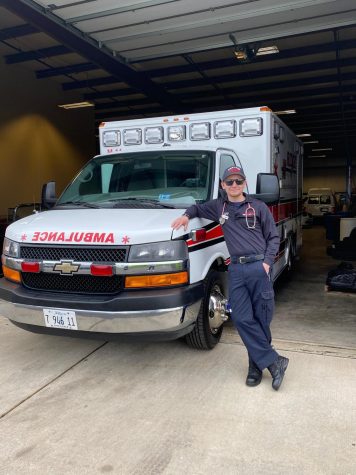 Charlie Platt stands proudly in the Montgomery Ridge Ambulance Service parking lot. Platt has dedicated his life to serving others.