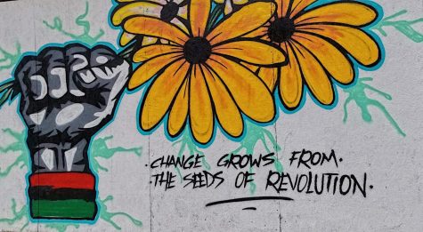To promote unity, Aurora artists paint the windows of downtown businesses with inspiring messages. Even during these hard times, people are able to come together to create something beautiful.