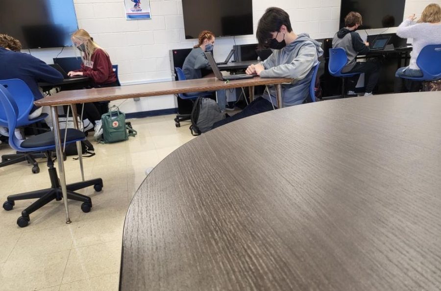 Students attending Kaneland High School work on their various assignments. Due to COVID-19 safety protocols, the masked students utilize their Chromebooks while physically distanced from one another. 