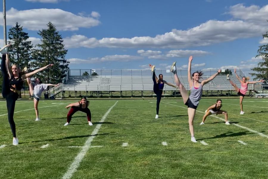 The Kaneland dance team practices on the Peterson Stadium field for an upcoming halftime routine. Each week, the team works to add dances for the next time they perform. 
