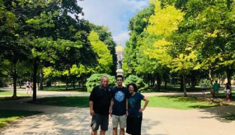 2021 Kaneland graduate Christopher Fountain stands with his parents in front of a statue of the founder of the University of Notre Dame, Edward F. Sorin. Fountain majors in mechanical engineering.