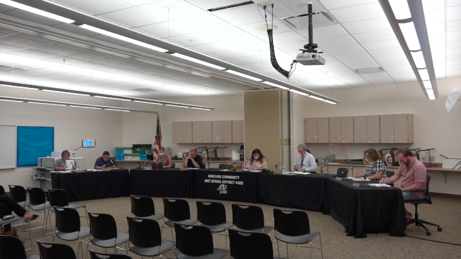 At the beginning of the meeting, Board Members are seen starting with a call to order. The meeting was held in the sixth grade team room at Kaneland Harter Middle School.