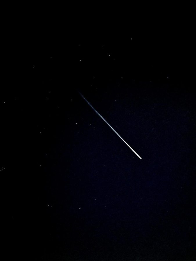 A+meteor+flies+through+the+night+sky.+Approximately+30+meteor+showers+that+are+visible+from+Earth+occur+each+year%2C+according+to+NASA.