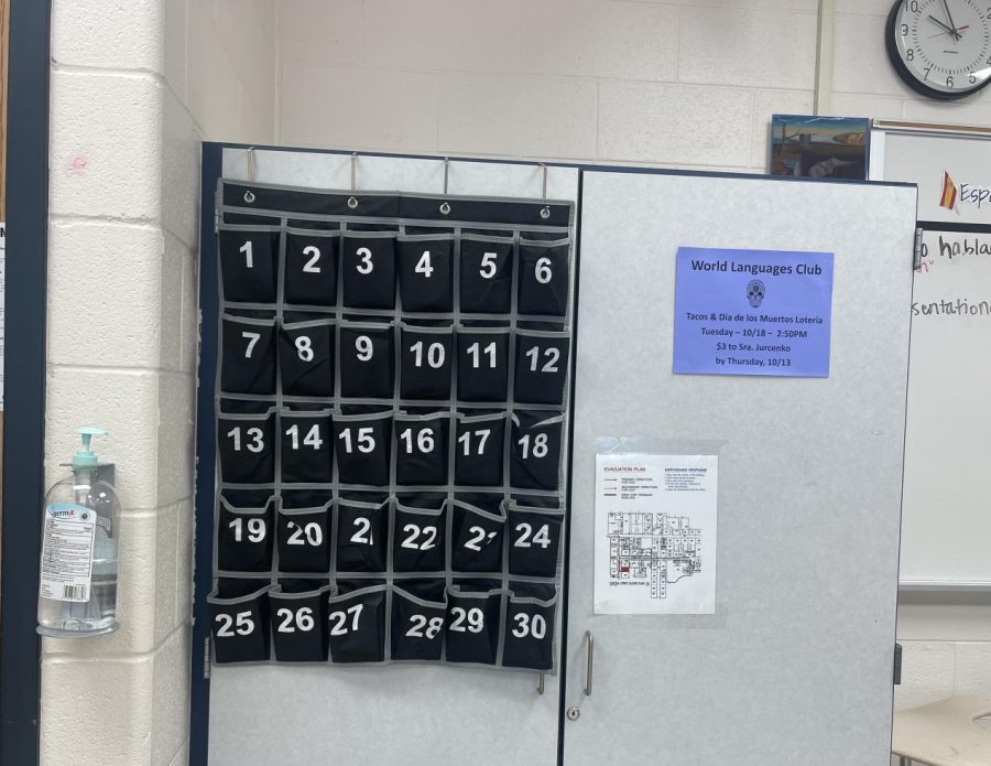 The phone pocket holder hangs in Spanish and French teacher Cristian Hernandez’s classroom. Each student has an assigned pocket for their phone.