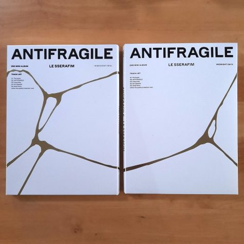 Two ANTIFRAGILE albums are lined up on the ground. The album surpassed 600,000 pre-ordered copies before its release on Oct. 17, 2022.