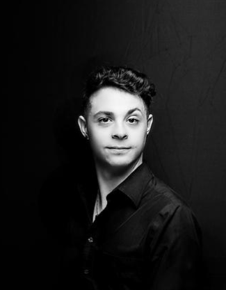 Paraprofessional and stage manager Benjamin Rogers poses for a professional headshot. Rogers has used this headshot for the multiple theater productions he has been a part of.