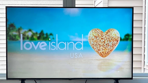 The title card of Love Island Usa features the same beach background and golden heart of the British version.  This was episode eight of season six.