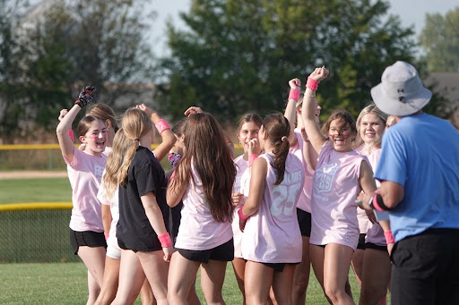 The senior Powderpuff team cheers after breaking out to finish practice. They leave with a smile, excited to face the juniors soon.