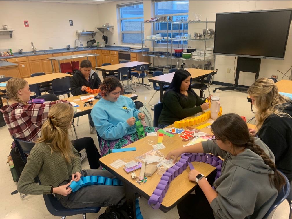 Members of Educators Rising gather for a club meeting. Students in this club can explore different careers in education and have opportunities to work with elementary students. 