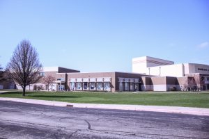 A patch of grass and multiple picnic tables currently sit in between the East Gym and the cafeteria. This area will be replaced by the addition of a fieldhouse after the April 1, 2025, election resulted in the passing of the proposed referendum.