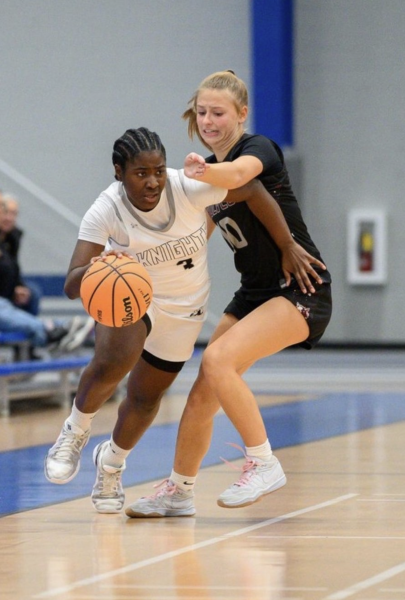 Junior Amani Meeks drives past her defender. Meeks scored 8 points as the Knights defeated Prairie Ridge
by a final score of 49-26 on November 18, 2025.